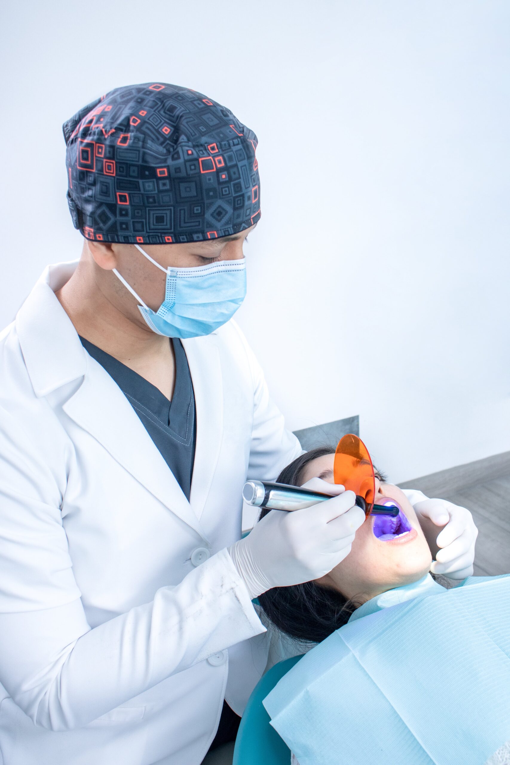 vertical-closeup-orthodontist-checking-patient-s-teeth-min